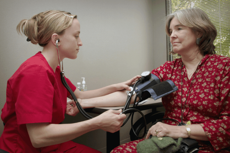 nurse-and-patient-in-healthcare-setting Transitional Care Management Example in Hospital and Surgical Center